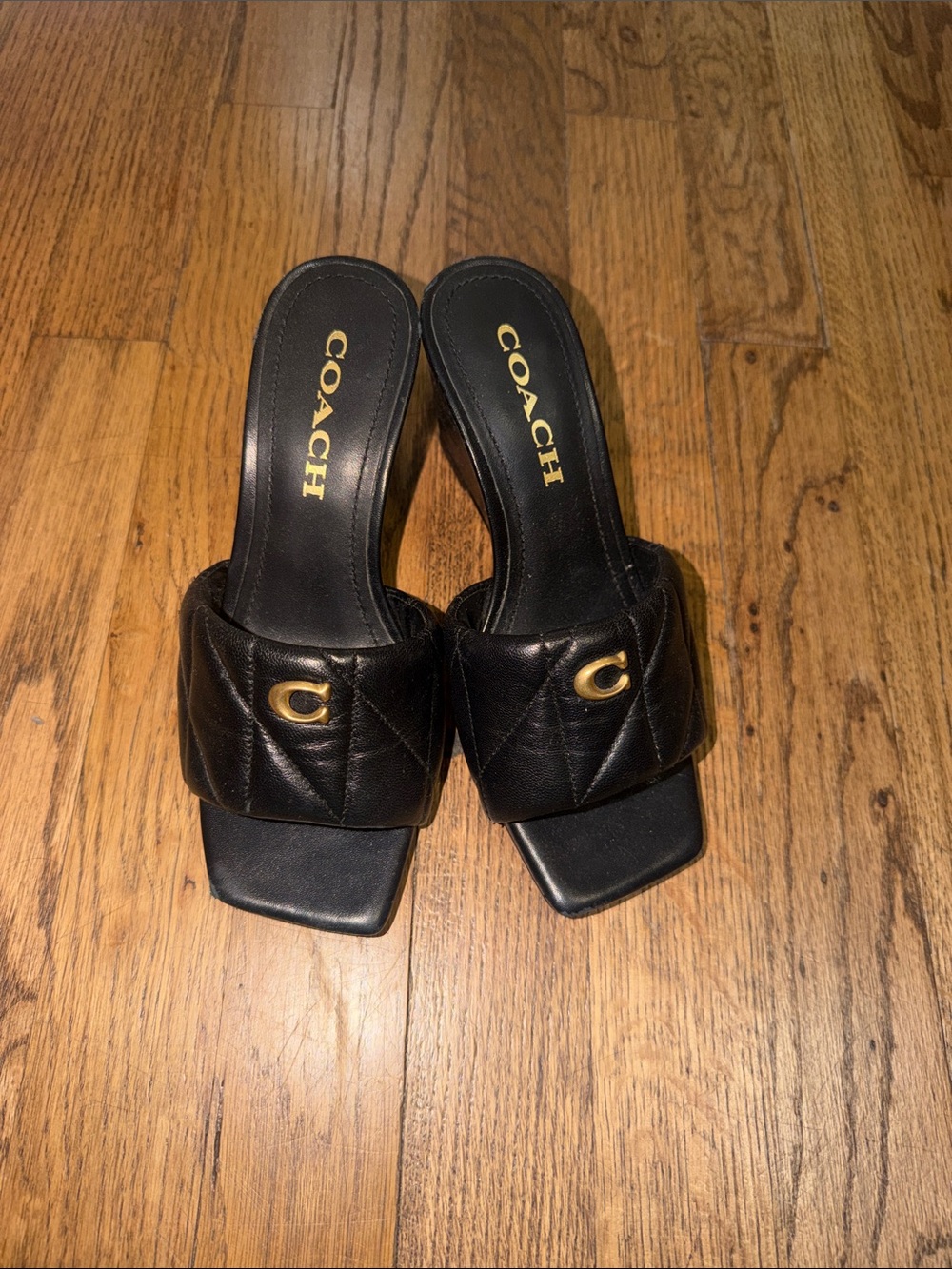 COACH Black Quilted Leather Slide Mules with Gold 'C' Accent